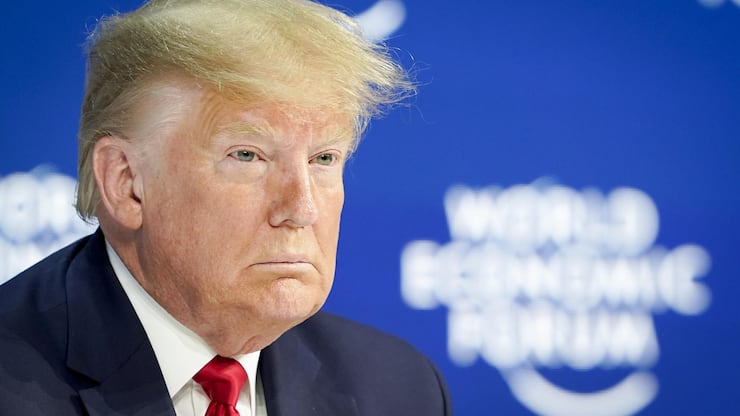 US President Donald Trump waits on stage before addressing a plenary session during to the 50th annual meeting of the World Economic Forum, WEF, in Davos, Switzerland, Tuesday, January 21, 2020. The meeting brings together entrepreneurs, scientists, corporate and political leaders in Davos from January 21 to 24. (KEYSTONE/Gian Ehrenzeller)