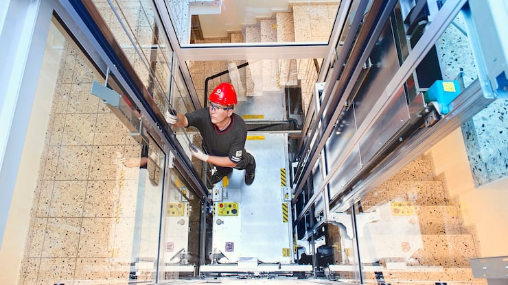 Fitter in elevator in Jona, Switzerland