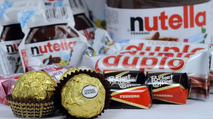 Ferrero SpA's Duplo, Fererro Rocher, Nutella, Mon Cheri and Pocket Coffee chocolate products are arranged for a photograph in Milan, Italy, on Thursday, Nov. 19, 2009. Michele Ferrero sold his first batch of Nutella spread in 1964. Four decades later, Italy's richest man must decide whether his company fast-tracks overseas growth by starting an auction for Cadbury Plc, or sticks to its recipe of homegrown sweets. Photographer: Giuseppe Aresu/Bloomberg