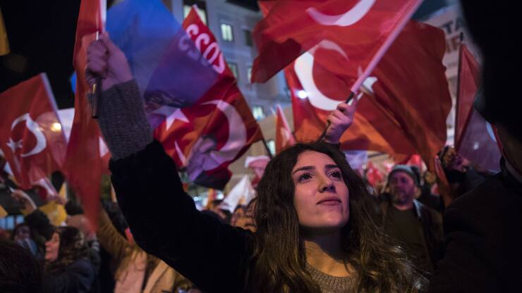 ISTANBUL, TURKEY - APRIL 01: People wave flags as they celebrate the unofficial results of local elections near AK Party's Istanbul Provincial Department in Istanbul, Turkey on April 01, 2019. (Photo by Arif Hudaverdi Yaman/Anadolu Agency/Getty Images)