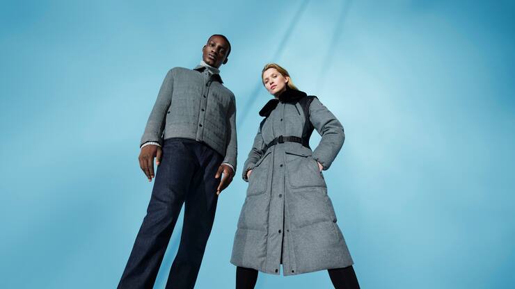 Mann und Frau in schwarzer und grauer Fusalp-Skibekleidung