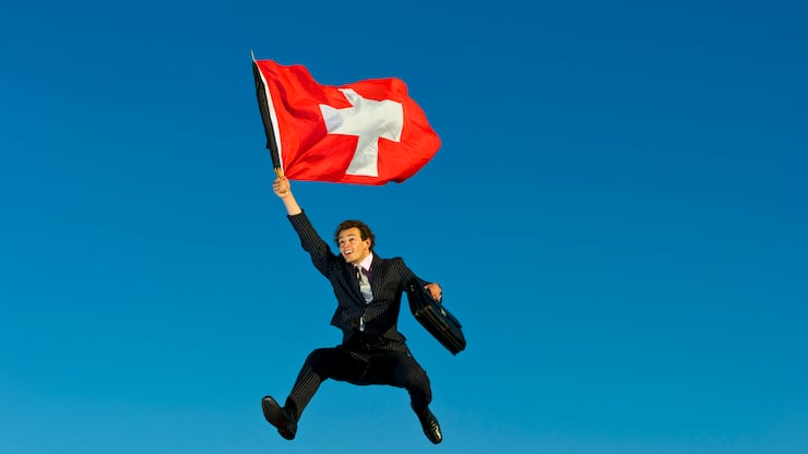 Businessman Flying the Flag for Switzerland.