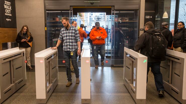 SEATTLE, WA - JANUARY 22: Shoppers enter and check out with purchases at the Amazon Go, on January 22, 2018 in Seattle, Washington. After more than a year in beta Amazon opened the cashier-less store to the public. (Photo by Stephen Brashear/Getty Images)