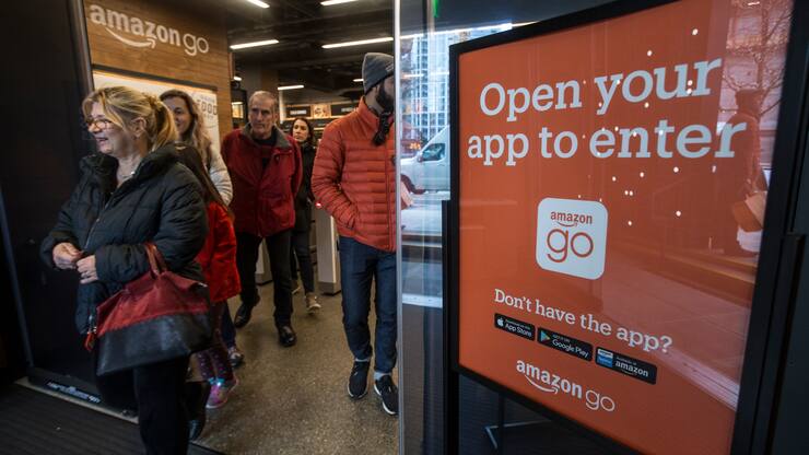 SEATTLE, WA - JANUARY 22: Shoppers leave the Amazon Go store after checking out on January 22, 2018 in Seattle, Washington. After more than a year in beta, the store is open to the public. (Photo by Stephen Brashear/Getty Images)