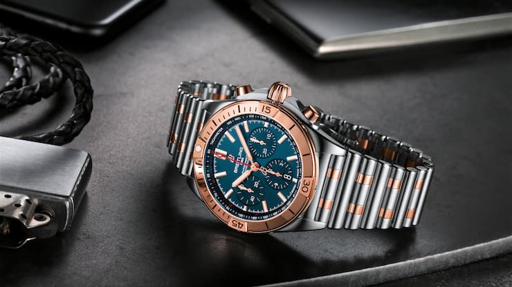 Two-tone Chronomat B01 42 with a blue dial and tone-on-tone chronograph counters highlighted by an 18 k red gold bezel, crown and pushers