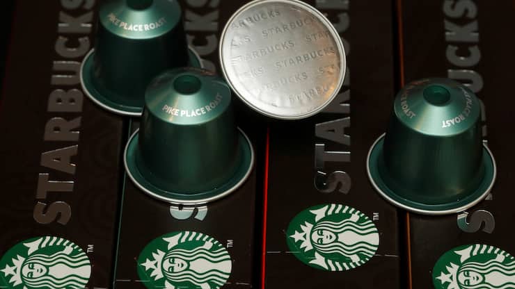 Starbucks labeled single-serve coffee capsules for Nespresso coffee makers are displayed after a news conference to announce that Nestle will sell Starbucks-branded coffee at grocery stores in Europe, Asia and Latin America at the company's headquarters in Vevey, Switzerland February 13, 2019. REUTERS/Arnd Wiegmann - RC19E03273B0