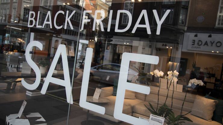 Shoppers on Oxford Street in central London with a sign advertising Black Friday in a shop window on 25th November 2017 in London, England, United Kingdom. This is the busiest shopping district in the capital with Oxford Street being Europe's busiest shopping area. (photo by Mike Kemp/In Pictures via Getty Images)