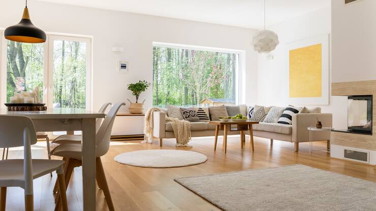 Stylish design of spacious living room connected with dining hall