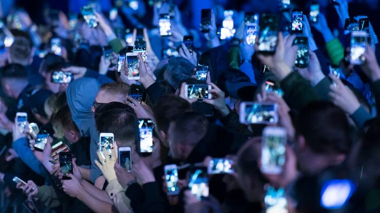 CARDIFF, UNITED KINGDOM - MAY 02: Spectators hold up mobile phones at an event on May 2, 2018 in Cardiff, United Kingdom. (Photo by Matthew Horwood/Getty Images)
