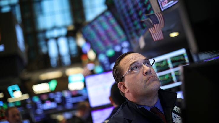 NEW YORK, NY - MAY 1:  A trader works at his desk on the floor of the New York Stock Exchange (NYSE) ahead of the closing bell, May 1, 2019 in New York City. Following the Federal Reserve's announcement that interest rates will remain unchanged, the Dow Jones Industrial was own 162 points at the close of the trading session on Wednesday. (Photo by Drew Angerer/Getty Images)