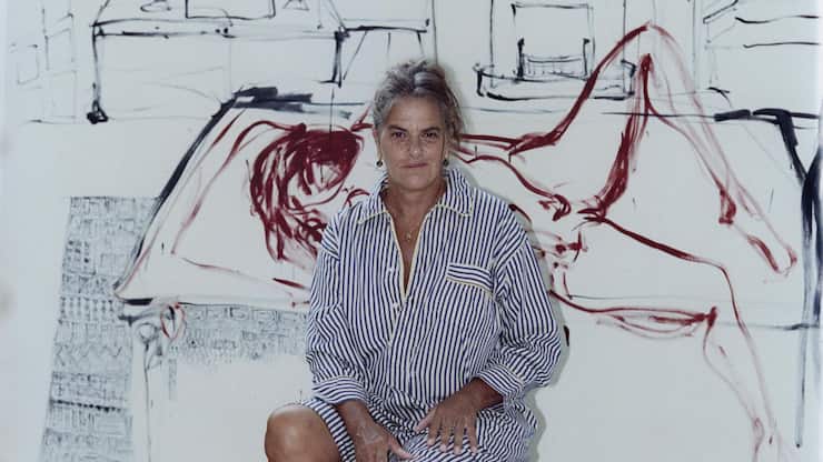 Tracey Emin with a painting in progress at her studio in Margate, England, Sept. 28, 2023. (Charlie Gates/The New York Times)
