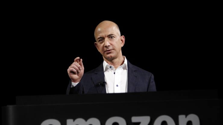 File- This Sept. 6, 2012, file photo shows  Jeff Bezos, CEO and founder of Amazon, at the introduction of the new Amazon Kindle Fire HD and Kindle Paperwhite personal devices, in Santa Monica, Calif. An official in the Galapagos Islands says that Bezos was flown by helicopter from a cruise ship on Jan. 1 for medical attention after suffering intense pain because of a kidney stone. (AP Photo/Reed Saxon, File)