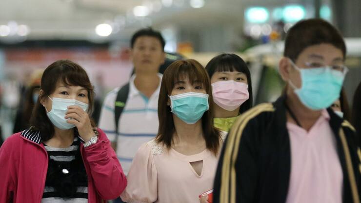 Thailands Hauptstädter tragen jetzt Maske