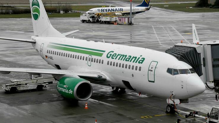 aircraft of German Germania airline is parked at Schoenefeld airport near Berlin. Germania has applied for insolvency. (Bernd Settnik/dpa via AP)