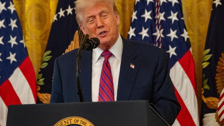 President Trump signs the GENIUS cryptocurrency bill at the White House on July 18, 2025. (Photo by Andrew Leyden/NurPhoto)