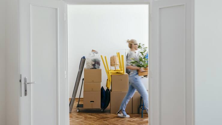 An Anonymous Woman Moving In Into New Apartment