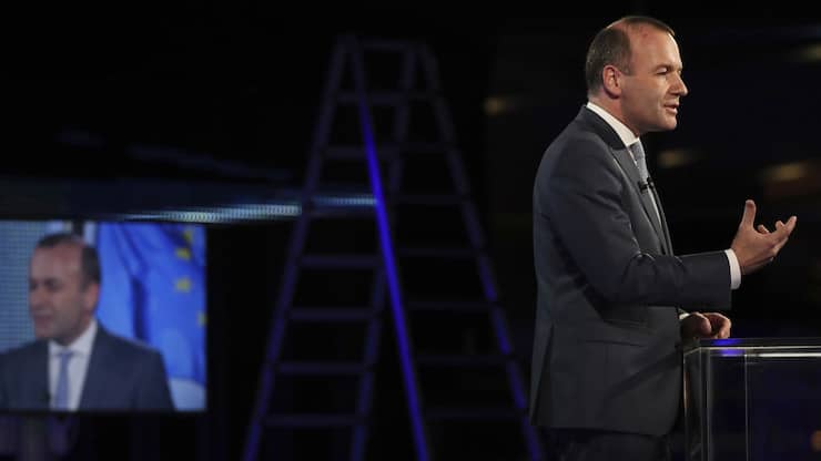 Candidate to the presidency of the European Commission, Germany's Manfred Weber, speaks as he arrives at the European Parliament in Brussels, Sunday, May 26, 2019. From Germany and France to Cyprus and Estonia, voters from 21 nations went to the polls Sunday in the final day of a crucial European Parliament election that could see major gains by the far-right, nationalist and populist movements that are on the rise across much of the continent. (AP Photo/Francisco Seco)