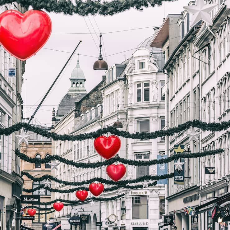 Heart shaped Christmas decorations and buildings in StrÃ¸get street