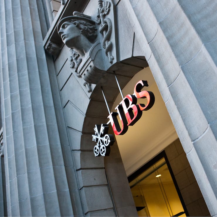 A relief sculpture hangs above the entrance to the UBS headquarters on Bahnhofstrasse in Zurich, Switzerland, on Tuesday, Feb. 9, 2010. UBS AG, the European bank with the biggest losses from the credit crisis, said withdrawals by wealthy clients accelerated in the fourth quarter, even as thecompany reported its first profit in more than a year. Photographer: Reto Andreoli/Bloomberg