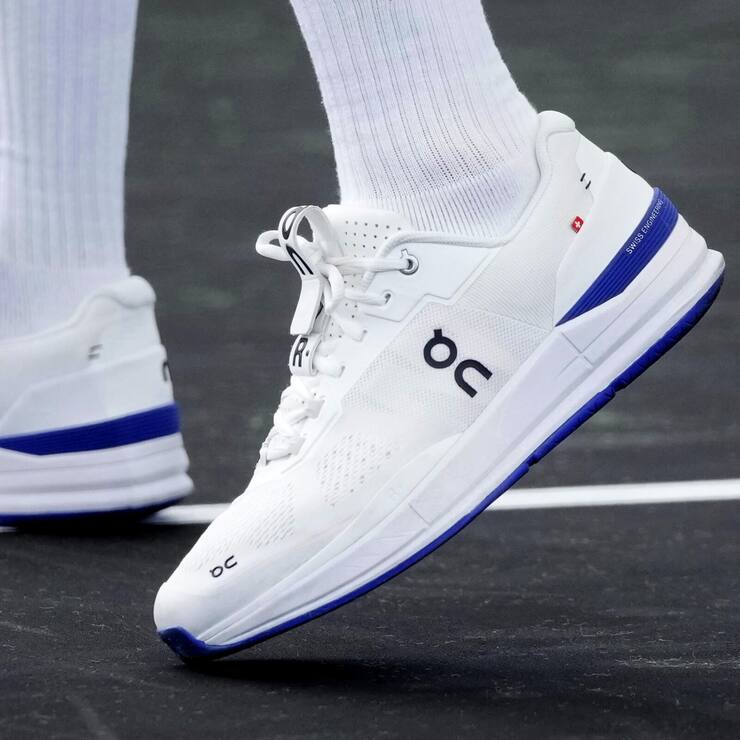 Switzerland's Roger Federer sports a pair of shoes as he attends a training session ahead of the Laver Cup tennis tournament at the O2 in London, Wednesday, Sept. 21, 2022. Federer appeared earlier at a news conference to discuss his retirement from professional tennis at age 41 after a series of knee operations. He will close his career with a doubles match at the Laver Cup on Friday . (AP Photo/Kin Cheung)
