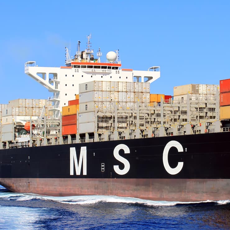 Container ship sailing close to the city of Alicante., Big container ship of MSC Company approaching to Alicante city in Spain for download cargo.