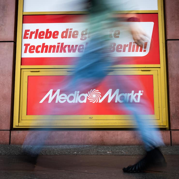 BERLIN, GERMANY - JULY 31: People walk past a MediaMarkt sign outside a MediaMarkt consumer electronics store on July 31, 2025 in Berlin, Germany. Chinese online retailer JD.com is planning to acquire Ceconomy, which owns both the Saturn and MediaMarkt chains. Both brands have stores across Europe. (Photo by Christian Mang/Getty Images)