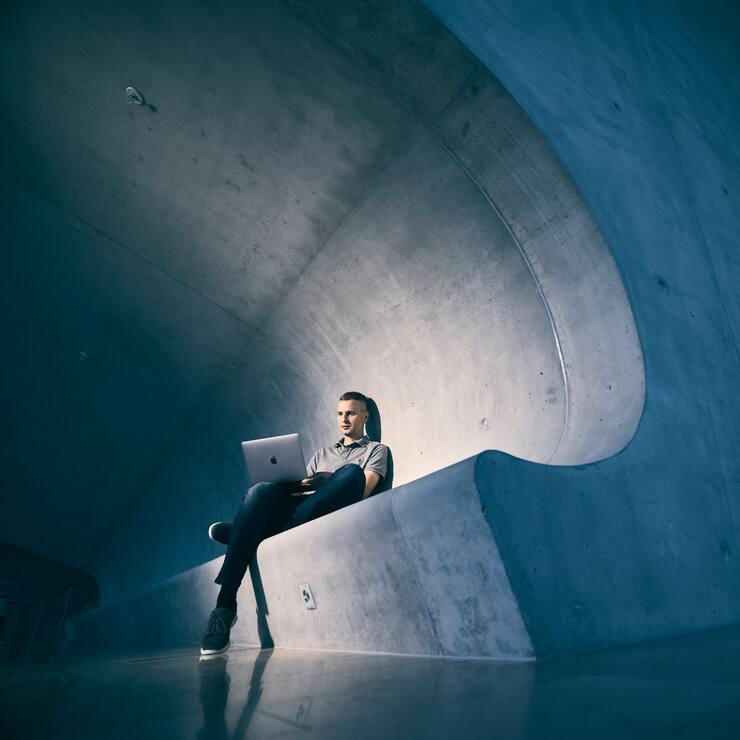 Alexander Denzler, lecturer for Blockchain Technology and Data Science at the Hochschule Luzern works on his notebook at the HSLU Campus in Rotkreuz,  Switzerland on July 10, 2020.Photo: Michael Buholzer