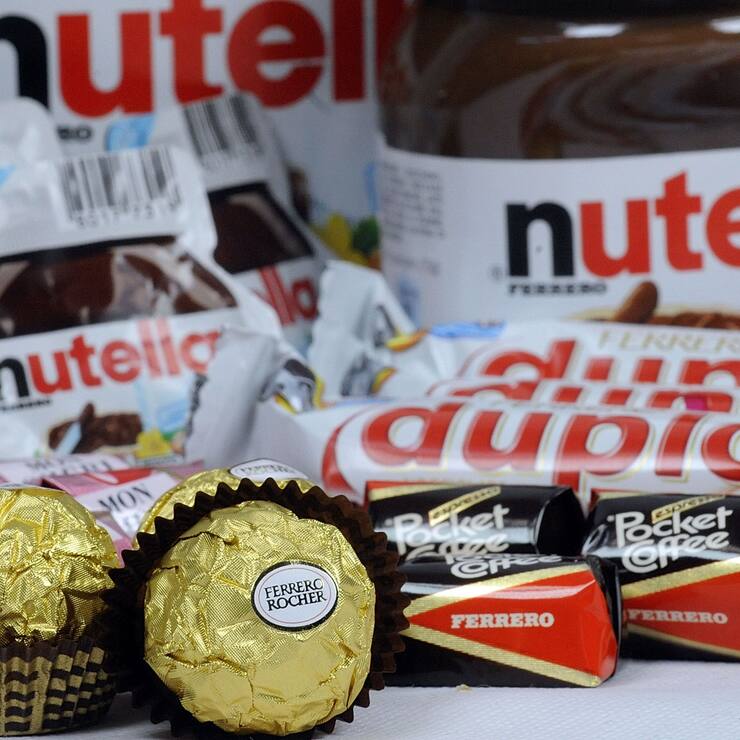 Ferrero SpA's Duplo, Fererro Rocher, Nutella, Mon Cheri and Pocket Coffee chocolate products are arranged for a photograph in Milan, Italy, on Thursday, Nov. 19, 2009. Michele Ferrero sold his first batch of Nutella spread in 1964. Four decades later, Italy's richest man must decide whether his company fast-tracks overseas growth by starting an auction for Cadbury Plc, or sticks to its recipe of homegrown sweets. Photographer: Giuseppe Aresu/Bloomberg