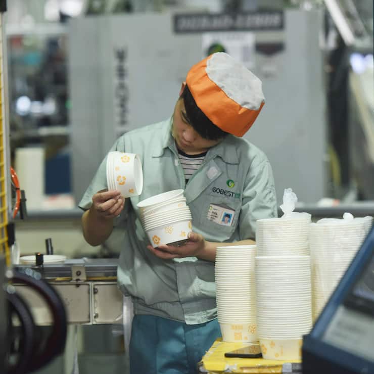HANGZHOU, CHINA - JANUARY 21: A worker looks at paper tableware at an environment-friendly tableware company on January 21, 2019 in Hangzhou, Zhejiang Province of China. China's gross domestic product (GDP) hit 90.03 trillion yuan (about 13.32 trillion U.S. dollars), increasing 6.6 percent year on year in 2018, according to the National Bureau of Statistics (NBS) on Monday. (Photo by VCG/VCG via Getty Images)