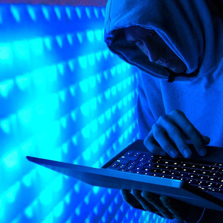 hooded computer hacker