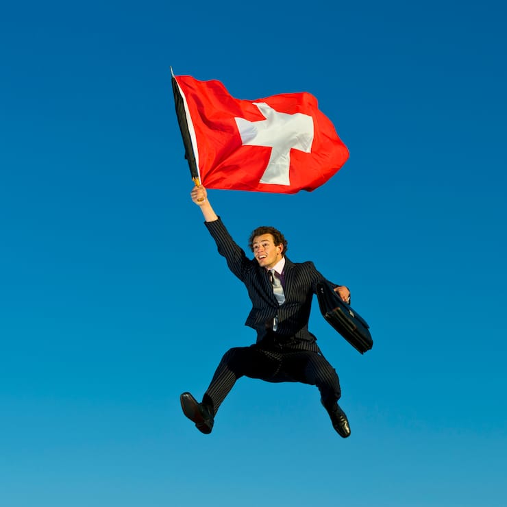 Businessman Flying the Flag for Switzerland.
