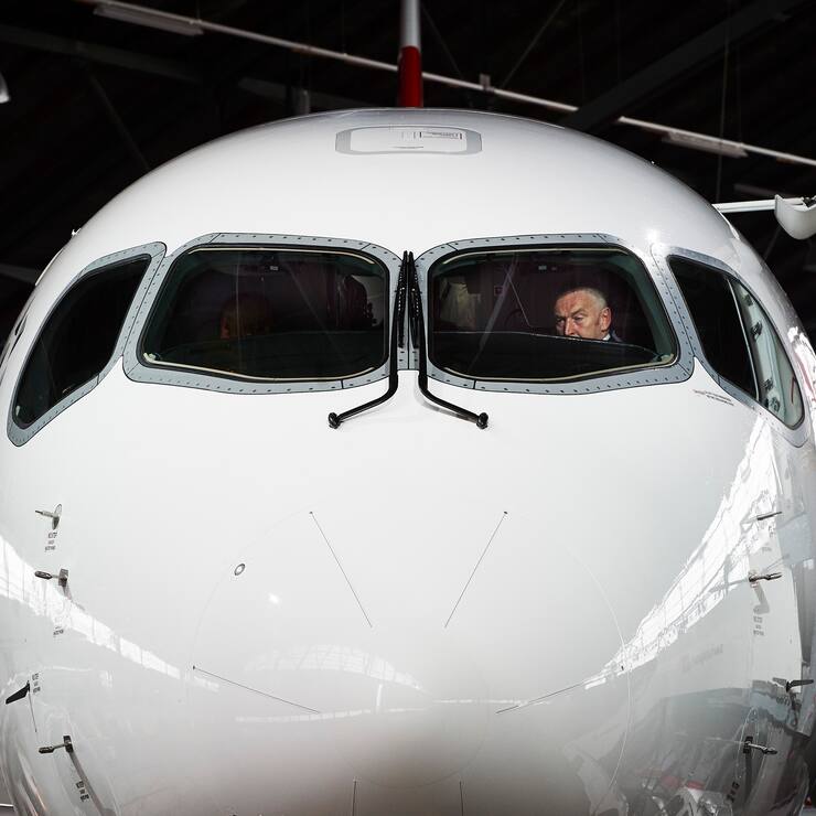 Swiss International Airlines Chief Executive Officer Thomas Kluehr sits in the cockpit of the Air Lines' new Bombardier CS 100 passenger jetliner during a media presentation at the Zurich Airport in Zurich on July 6, 2016. - Swiss International Air Lines' new Bombardier CS 100 jetliner is the first rolled out aircraft of the Canadian Bombardier Commercial Aircraft's new jetliner C-Series aircrafts. (Photo by MICHAEL BUHOLZER / AFP)