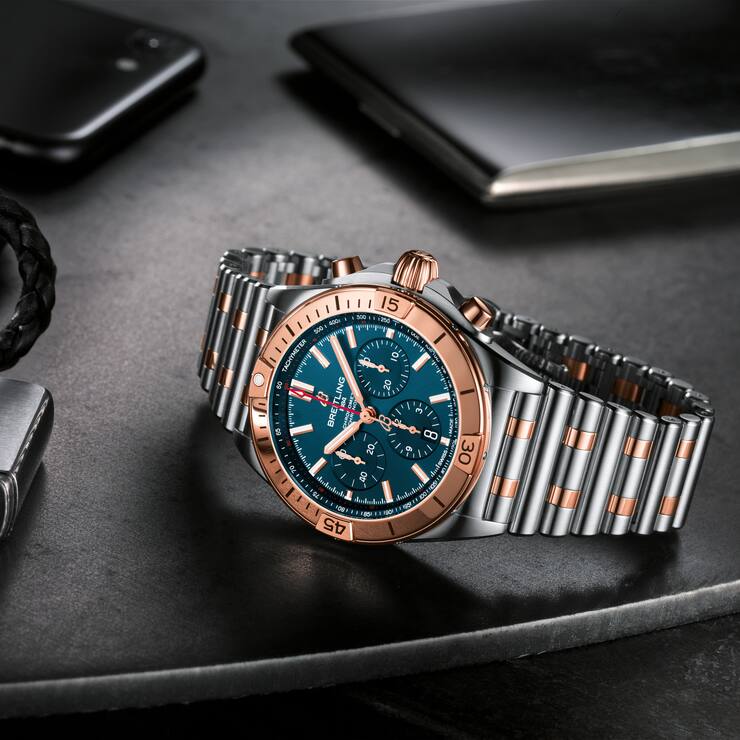Two-tone Chronomat B01 42 with a blue dial and tone-on-tone chronograph counters highlighted by an 18 k red gold bezel, crown and pushers