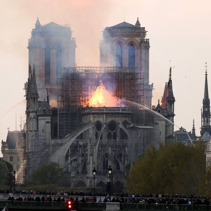 Flames and smoke are seen billowing from the roof at Notre-Dame Cathedral in Paris on April 15, 2019. A fire broke out at the landmark Notre-Dame Cathedral in central Paris, potentially involving renovation works being carried out at the site, the fire service said.Images posted on social media showed flames and huge clouds of smoke billowing above the roof of the gothic cathedral, the most visited historic monument in Europe. (Photo by Michel Stoupak/NurPhoto via Getty Images)