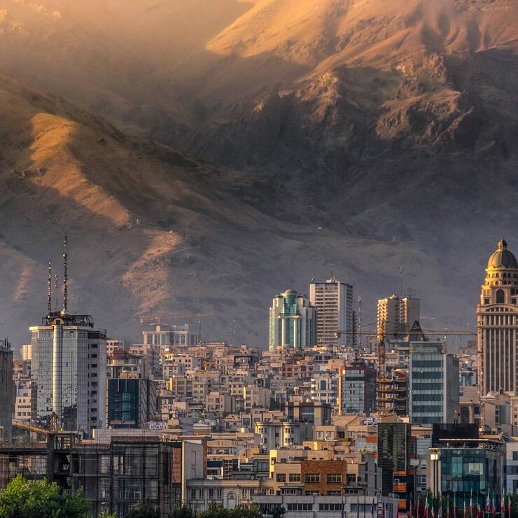 Tehran city building at the feet of the Alborz mountain range separating the rest of Iran from the Caspian sea basin, displaying the growth and development experienced by the Iranian capital.
