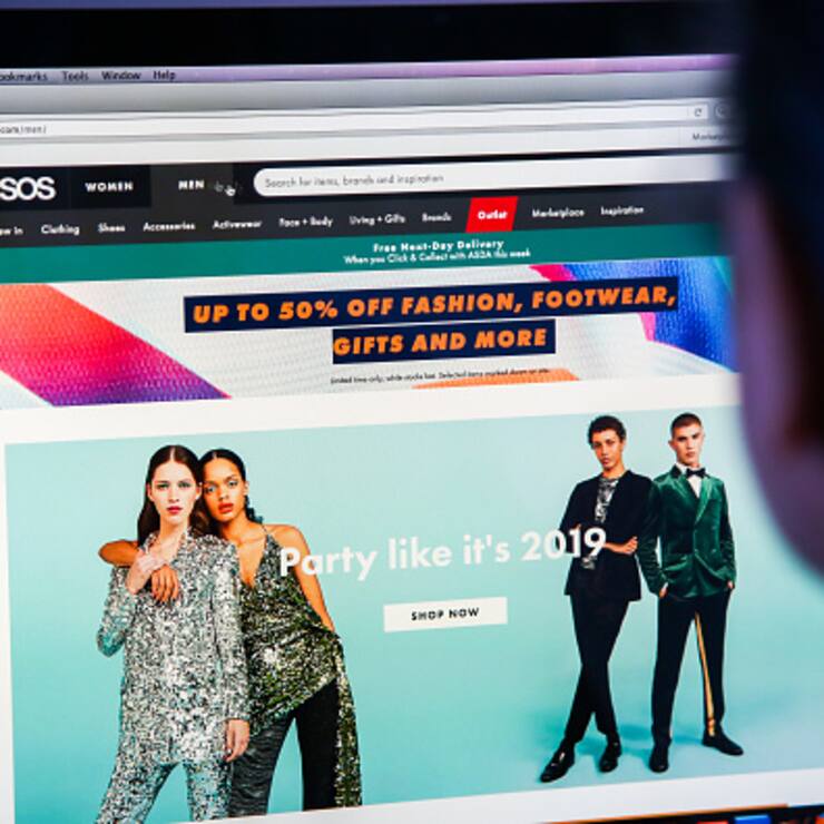 LONDON, UNITED KINGDOM - 2018/12/17: A woman is seen shopping on ASOS the online fashion store on a desktop. Shares in Asos tumbled nearly 40 per cent on Monday morning after the online fashion retailer warned of weak profits this financial year after "unprecedented" discounting hit its trading in November. (Photo by Dinendra Haria/SOPA Images/LightRocket via Getty Images)