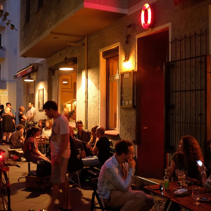 BERLIN, GERMANY - JUNE 02: People hang out at outdoor tables on the sidewalk at Oblomov bar on a warm evening in Neukoelln district on June 2, 2018 in Berlin, Germany. Many restaurants and bars offer outdoor seating during the warm summer months.  (Photo by Sean Gallup/Getty Images)
