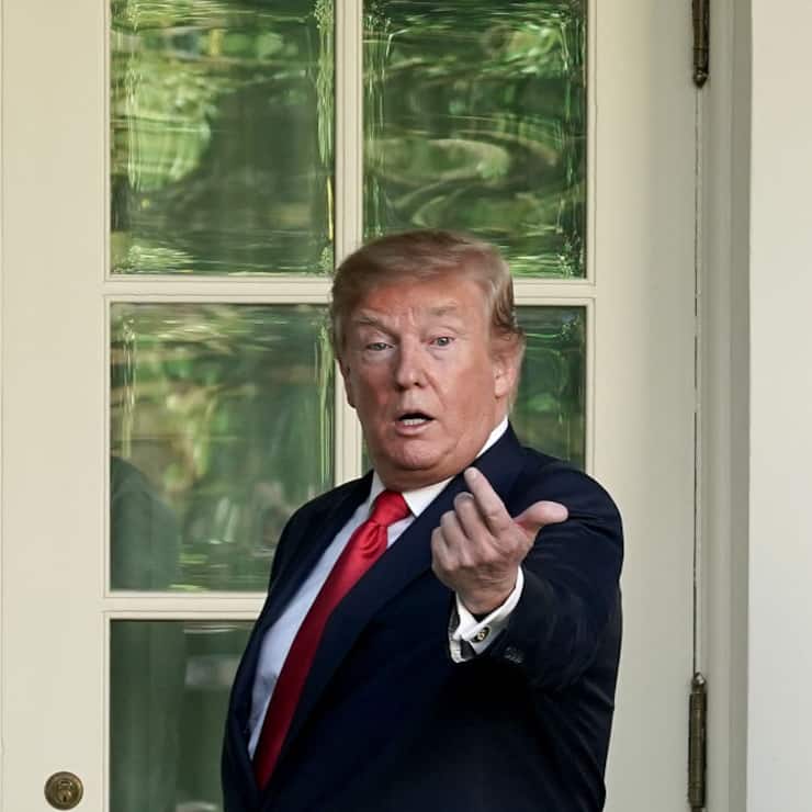 WASHINGTON, DC - MAY 06: U.S. President Donald Trump invites a guest into the Oval Office after presenting professional golfer and business partner Tiger Woods with the Medal of Freedom during a ceremony in the Rose Garden at the White House May 06, 2019 in Washington, DC. Trump announced he would give the nationâs highest civilian honor to Woods, 43, in honor of his Masters victory last month.  (Photo by Chip Somodevilla/Getty Images)