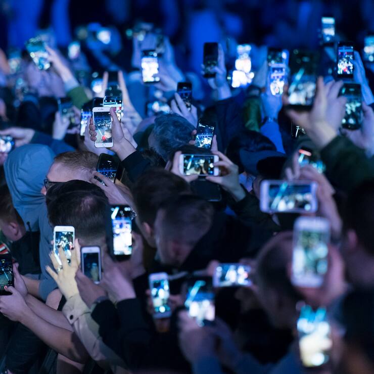 CARDIFF, UNITED KINGDOM - MAY 02: Spectators hold up mobile phones at an event on May 2, 2018 in Cardiff, United Kingdom. (Photo by Matthew Horwood/Getty Images)