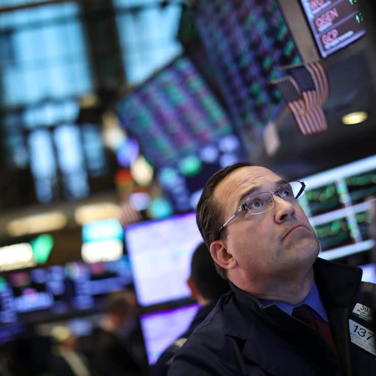 NEW YORK, NY - MAY 1:  A trader works at his desk on the floor of the New York Stock Exchange (NYSE) ahead of the closing bell, May 1, 2019 in New York City. Following the Federal Reserve's announcement that interest rates will remain unchanged, the Dow Jones Industrial was own 162 points at the close of the trading session on Wednesday. (Photo by Drew Angerer/Getty Images)