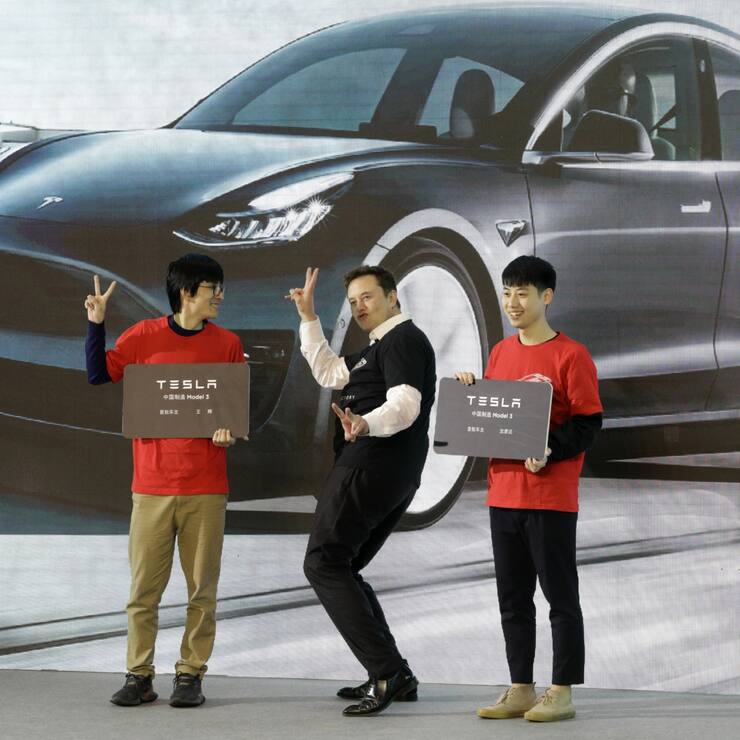 Elon Musk, chief executive officer of Tesla Inc., gestures during the Tesla China-Made Model 3 Delivery Ceremony at the company's Gigafactory in Shanghai, China, on Tuesday, Jan. 7, 2020. Tesla kicked off production in China, marking a major step in Musks global push for electric-vehicle domination and heralding what could be the dawn of real competition in the worlds largest EV market. Photographer: Qilai Shen/Bloomberg
