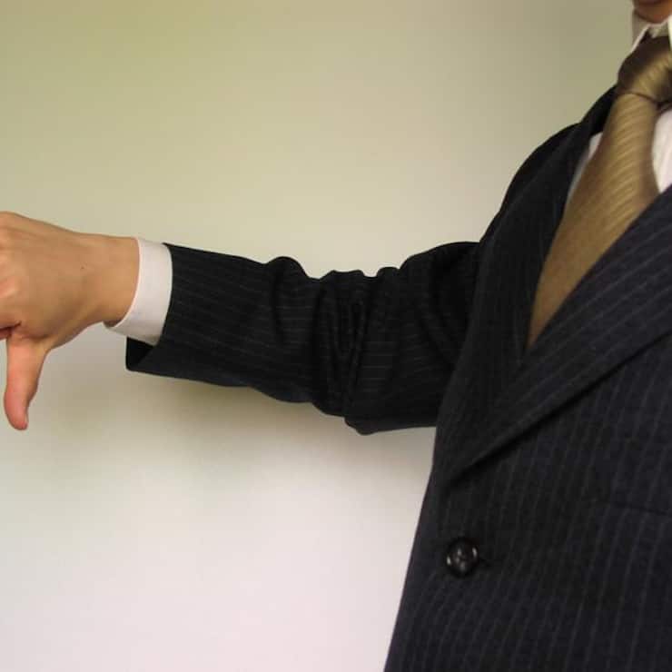 1729-business-man-in-a-suit-giving-thumbs-down-or.jpg