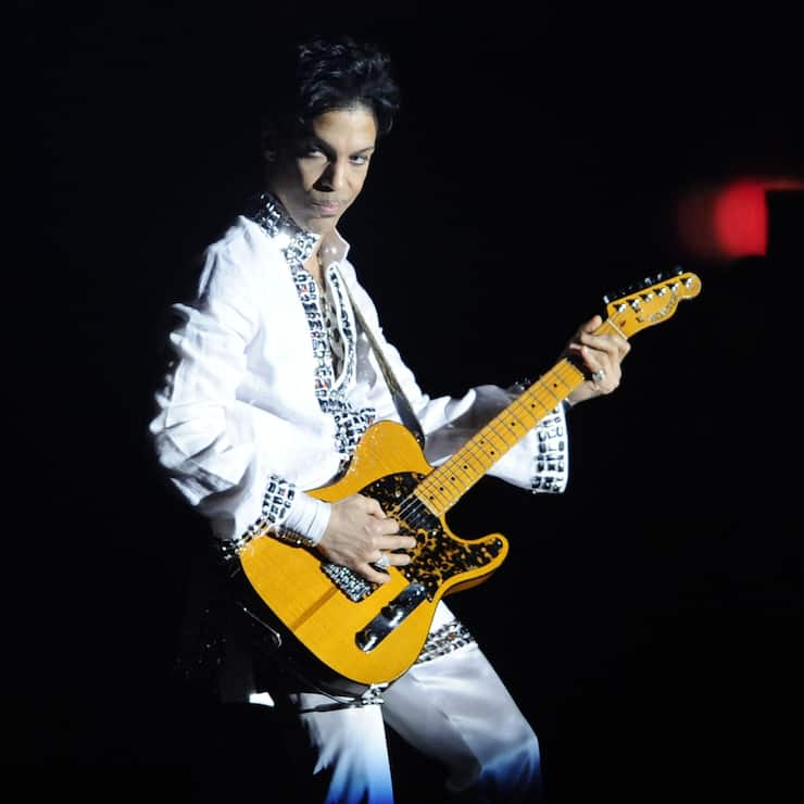 Prince performs during his headlining set on the second day of the Coachella Valley Music and Arts Festival in Indio, Calif., Saturday, April 26, 2008. (AP Photo/Chris Pizzello)