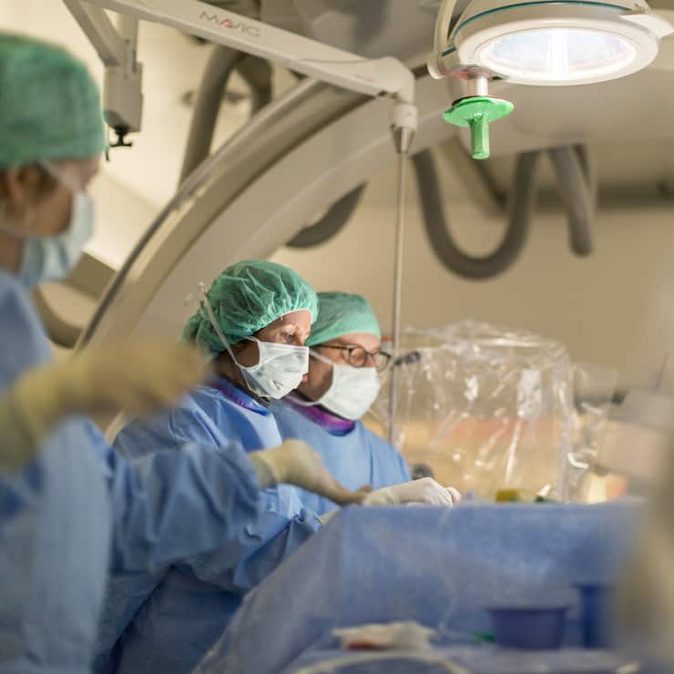 Prof. Dr. med. Isabel Wanke and Prof. Dr. med. Daniel Ruefenacht perform endovascular coiling to treat a brain aneurysm in the NeuroSuite operating theater at the Hirslanden Hospital in Zurich, Switzerland, on April 9, 2015. 