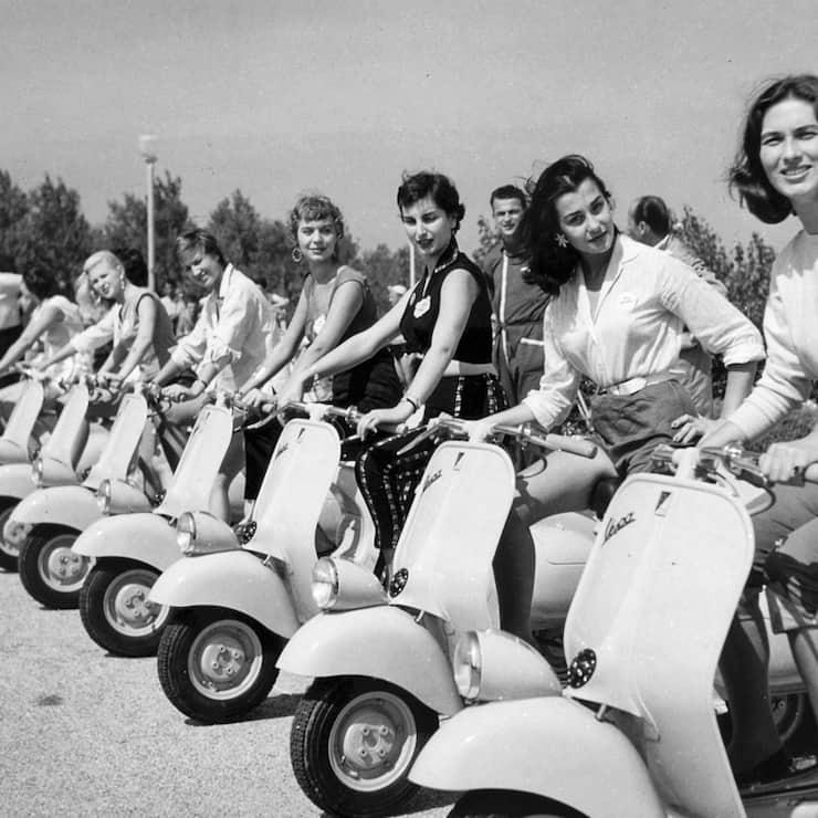 Transport, Scooters, pic: circa 1955, A line up of Vespa motor scooters with young ladies (Photo by Popperfoto via Getty Images/Getty Images)
