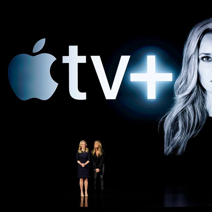 Actresses Reese Witherspoon, left, and Jennifer Aniston speak at the Steve Jobs Theater during an event to announce new products Monday, March 25, 2019, in Cupertino, Calif. (AP Photo/Tony Avelar)