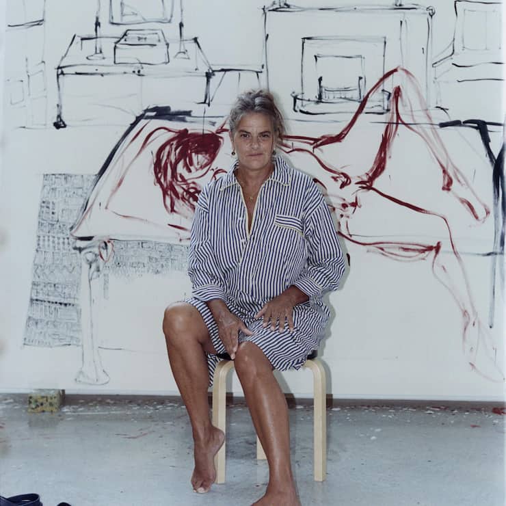 Tracey Emin with a painting in progress at her studio in Margate, England, Sept. 28, 2023. (Charlie Gates/The New York Times)