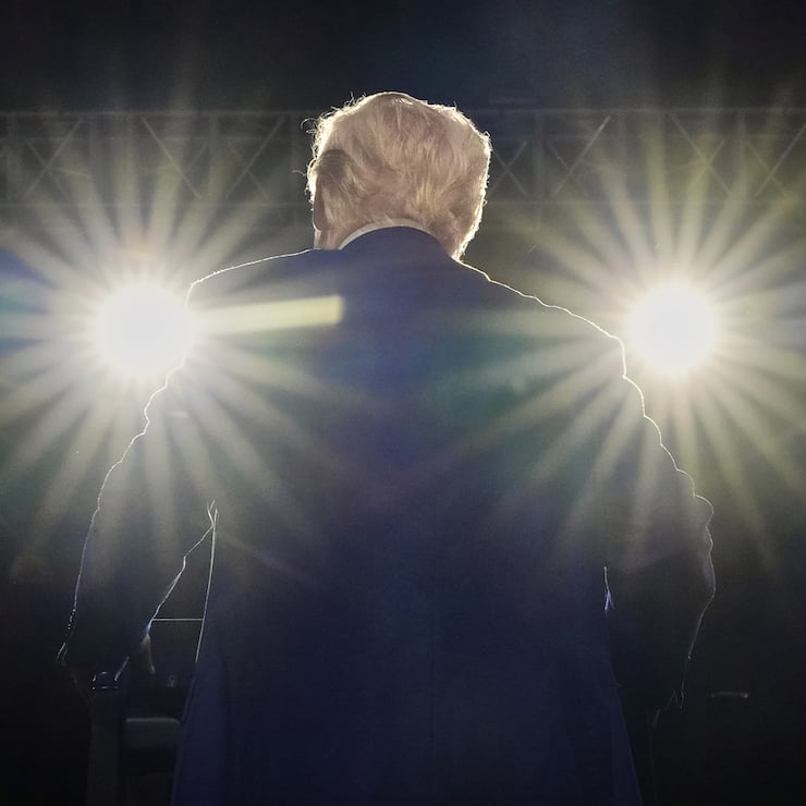 President Donald Trump smiles on stage at the Al Udeid Air Base, Thursday, May 15, 2025, in Doha, Qatar. (AP Photo/Alex Brandon)