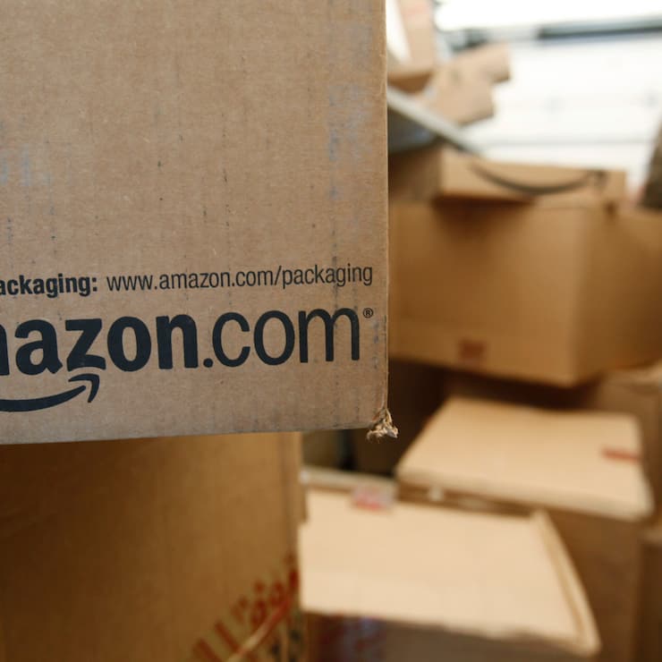 FILE - In this Oct. 18, 2010 file photo, an Amazon.com package awaits delivery from UPS in Palo Alto, Calif. Amazon on Thursday, March 13, 2014 said it is raising the price of its popular Prime membership to $99 per year, an increase of $20. It's the first price increase since the online retailer introduced its Prime membership program in 2005. T(AP Photo/Paul Sakuma, File)