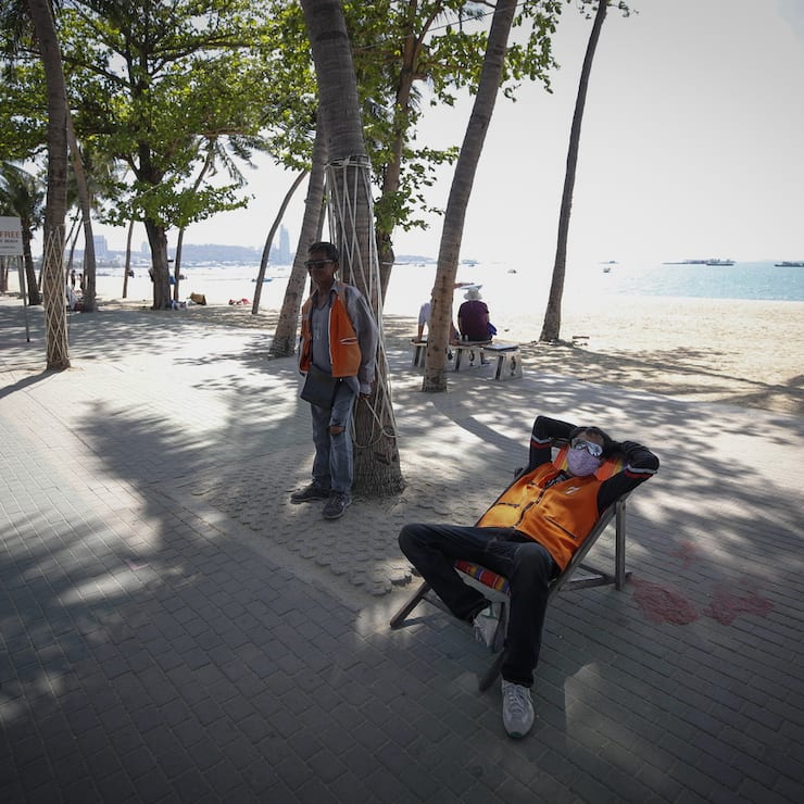 epa08278806 Motorcycle taxi drivers wait for customers by a usually busy beach in Pattaya city, Chonburi province, Thailand, 07 March 2020 (issued 08 March 2020). The novel coronavirus outbreak hit Thailand's tourism sector, as the Tourism Authority of Thailand (TAT) announced on 02 March that the number of tourists visiting the country in 2020 could drop by 6 million, the lowest in four years. EPA/DIEGO AZUBEL